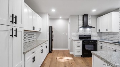 Completely remodeled inside and out, this 3-bedroom, 3-bath home on Tanglewood Shores Golf Club in Virginia - for sale on GolfHomes.com, golf home, golf lot