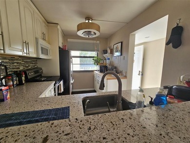 Spacious unit overlooking Via Mizner Golf Course. Open floor on The Country Club At Boca Raton in Florida - for sale on GolfHomes.com, golf home, golf lot