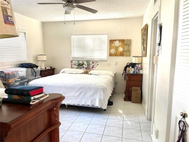 Beautiful 2-bedroom, 2-bathroom CORNER AND FIRST FLOOR condo in on Oriole Golf and Tennis Club in Florida - for sale on GolfHomes.com, golf home, golf lot