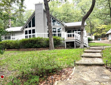 All Tucked Away on Holly Lake Ranch Golf Club in Texas - for sale on GolfHomes.com, golf home, golf lot