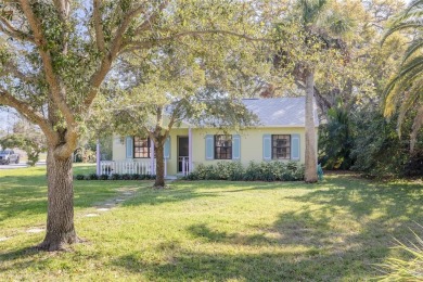 Welcome to Dunedin's Leafy Green Cottage! Nestled in the on The Dunedin Country Club in Florida - for sale on GolfHomes.com, golf home, golf lot