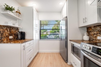 Experience effortless living in this light-filled first-floor on Boca Lago Golf and Country Club in Florida - for sale on GolfHomes.com, golf home, golf lot