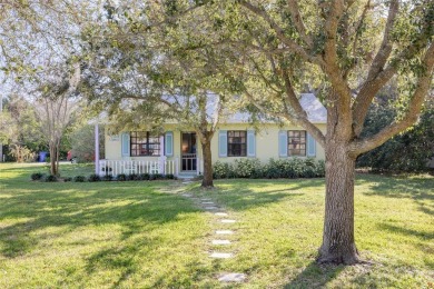 Welcome to Dunedin's Leafy Green Cottage! Nestled in the on The Dunedin Country Club in Florida - for sale on GolfHomes.com, golf home, golf lot