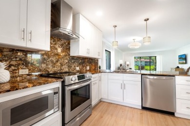 Experience effortless living in this light-filled first-floor on Boca Lago Golf and Country Club in Florida - for sale on GolfHomes.com, golf home, golf lot