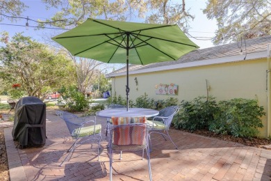 Welcome to Dunedin's Leafy Green Cottage! Nestled in the on The Dunedin Country Club in Florida - for sale on GolfHomes.com, golf home, golf lot