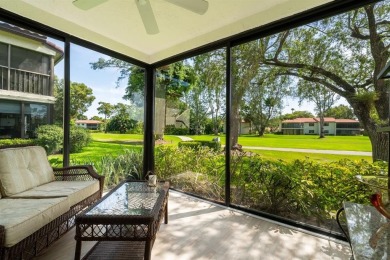 Experience effortless living in this light-filled first-floor on Boca Lago Golf and Country Club in Florida - for sale on GolfHomes.com, golf home, golf lot