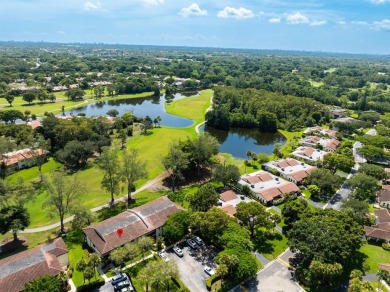 Experience effortless living in this light-filled first-floor on Boca Lago Golf and Country Club in Florida - for sale on GolfHomes.com, golf home, golf lot