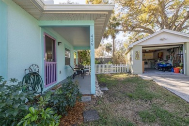 Welcome to Dunedin's Leafy Green Cottage! Nestled in the on The Dunedin Country Club in Florida - for sale on GolfHomes.com, golf home, golf lot