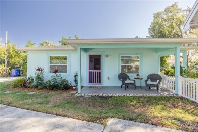 Welcome to Dunedin's Leafy Green Cottage! Nestled in the on The Dunedin Country Club in Florida - for sale on GolfHomes.com, golf home, golf lot