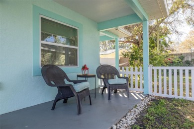 Welcome to Dunedin's Leafy Green Cottage! Nestled in the on The Dunedin Country Club in Florida - for sale on GolfHomes.com, golf home, golf lot