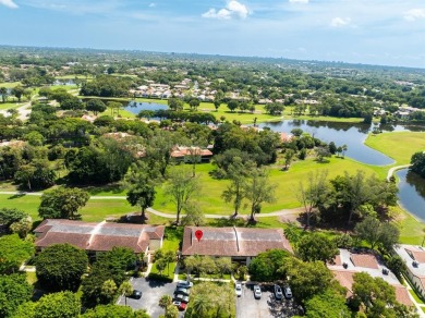 Experience effortless living in this light-filled first-floor on Boca Lago Golf and Country Club in Florida - for sale on GolfHomes.com, golf home, golf lot