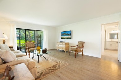 Experience effortless living in this light-filled first-floor on Boca Lago Golf and Country Club in Florida - for sale on GolfHomes.com, golf home, golf lot