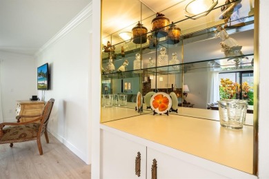 Experience effortless living in this light-filled first-floor on Boca Lago Golf and Country Club in Florida - for sale on GolfHomes.com, golf home, golf lot