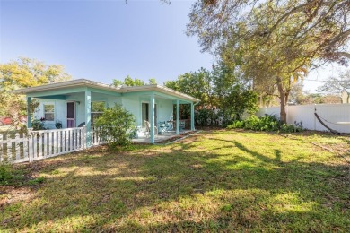 Welcome to Dunedin's Leafy Green Cottage! Nestled in the on The Dunedin Country Club in Florida - for sale on GolfHomes.com, golf home, golf lot