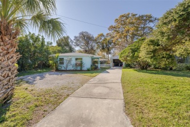 Welcome to Dunedin's Leafy Green Cottage! Nestled in the on The Dunedin Country Club in Florida - for sale on GolfHomes.com, golf home, golf lot