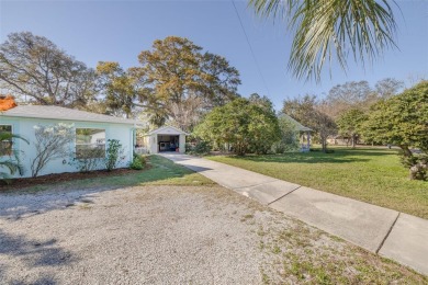 Welcome to Dunedin's Leafy Green Cottage! Nestled in the on The Dunedin Country Club in Florida - for sale on GolfHomes.com, golf home, golf lot