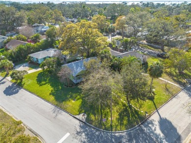 Welcome to Dunedin's Leafy Green Cottage! Nestled in the on The Dunedin Country Club in Florida - for sale on GolfHomes.com, golf home, golf lot