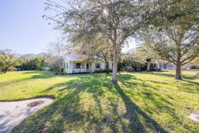 Welcome to Dunedin's Leafy Green Cottage! Nestled in the on The Dunedin Country Club in Florida - for sale on GolfHomes.com, golf home, golf lot