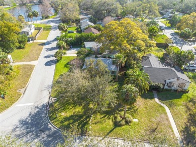 Welcome to Dunedin's Leafy Green Cottage! Nestled in the on The Dunedin Country Club in Florida - for sale on GolfHomes.com, golf home, golf lot