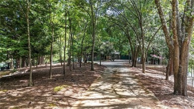 Experience ultimate privacy and breathtaking views from this on The Highlands Course at Lake Arrowhead in Georgia - for sale on GolfHomes.com, golf home, golf lot
