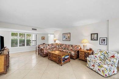 Exceptional golf course views wrap around this renovated on Quail Ridge Golf Course and Country Club in Florida - for sale on GolfHomes.com, golf home, golf lot