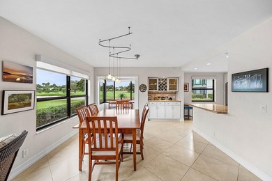 Exceptional golf course views wrap around this renovated on Quail Ridge Golf Course and Country Club in Florida - for sale on GolfHomes.com, golf home, golf lot