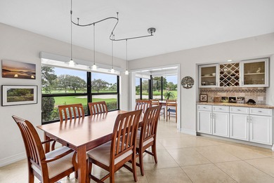 Exceptional golf course views wrap around this renovated on Quail Ridge Golf Course and Country Club in Florida - for sale on GolfHomes.com, golf home, golf lot