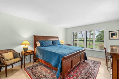 Exceptional golf course views wrap around this renovated on Quail Ridge Golf Course and Country Club in Florida - for sale on GolfHomes.com, golf home, golf lot