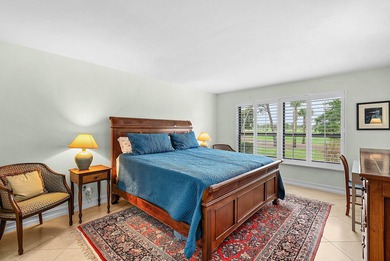 Exceptional golf course views wrap around this renovated on Quail Ridge Golf Course and Country Club in Florida - for sale on GolfHomes.com, golf home, golf lot