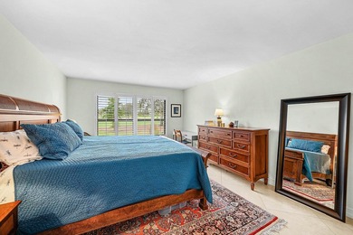 Exceptional golf course views wrap around this renovated on Quail Ridge Golf Course and Country Club in Florida - for sale on GolfHomes.com, golf home, golf lot