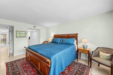 Exceptional golf course views wrap around this renovated on Quail Ridge Golf Course and Country Club in Florida - for sale on GolfHomes.com, golf home, golf lot