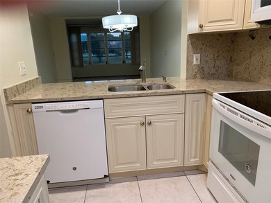 This is a lovely condo located in the well sort after community on Pine Island Ridge Country Club in Florida - for sale on GolfHomes.com, golf home, golf lot