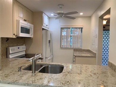 This is a lovely condo located in the well sort after community on Pine Island Ridge Country Club in Florida - for sale on GolfHomes.com, golf home, golf lot