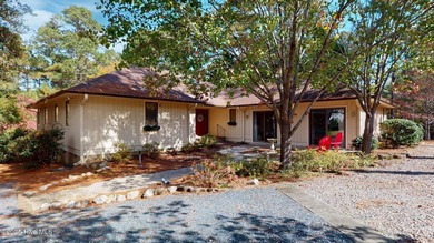 Welcome to this charming and spacious one-story home situated on on Whispering Pines Golf Course in North Carolina - for sale on GolfHomes.com, golf home, golf lot