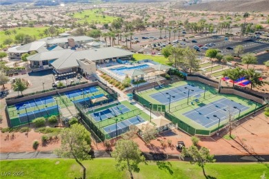 Step into the vibrant lifestyle of Sun City MacDonald Ranch, one on Desert Willow Golf Course in Nevada - for sale on GolfHomes.com, golf home, golf lot