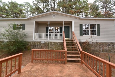 Situated on roughly 5.5 acres, this mobile home offers ample on Mountain Ranch Golf Club in Arkansas - for sale on GolfHomes.com, golf home, golf lot