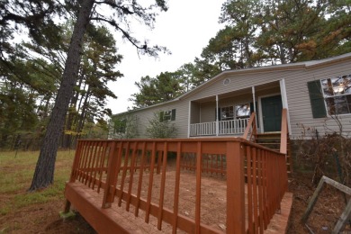 Situated on roughly 5.5 acres, this mobile home offers ample on Mountain Ranch Golf Club in Arkansas - for sale on GolfHomes.com, golf home, golf lot