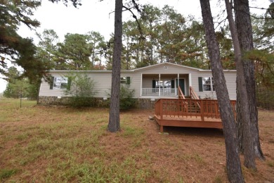 Situated on roughly 5.5 acres, this mobile home offers ample on Mountain Ranch Golf Club in Arkansas - for sale on GolfHomes.com, golf home, golf lot