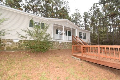 Situated on roughly 5.5 acres, this mobile home offers ample on Mountain Ranch Golf Club in Arkansas - for sale on GolfHomes.com, golf home, golf lot