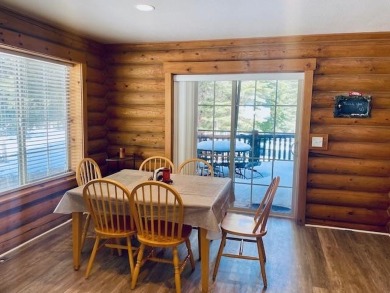 Cutest original log cabin that sits along the ninth fairway at on Lake Almanor West Golf Course in California - for sale on GolfHomes.com, golf home, golf lot