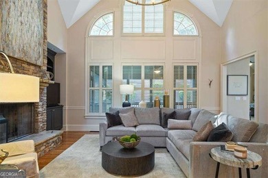Discover timeless elegance and modern comfort in this on Woodmont Golf and Country Club in Georgia - for sale on GolfHomes.com, golf home, golf lot