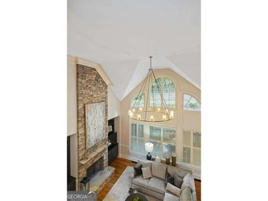 Discover timeless elegance and modern comfort in this on Woodmont Golf and Country Club in Georgia - for sale on GolfHomes.com, golf home, golf lot