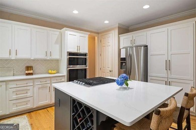 Discover timeless elegance and modern comfort in this on Woodmont Golf and Country Club in Georgia - for sale on GolfHomes.com, golf home, golf lot