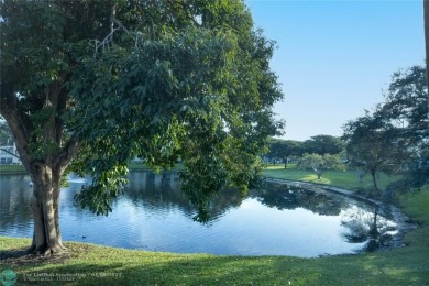 A breathtaking view and a peaceful living environment where life on Wynmoor Golf Course in Florida - for sale on GolfHomes.com, golf home, golf lot
