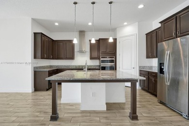 This beautiful home is located in the highly sought-after Lake on Eagle Creek Golf Club in Florida - for sale on GolfHomes.com, golf home, golf lot