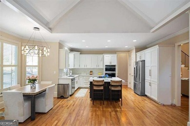 Discover timeless elegance and modern comfort in this on Woodmont Golf and Country Club in Georgia - for sale on GolfHomes.com, golf home, golf lot