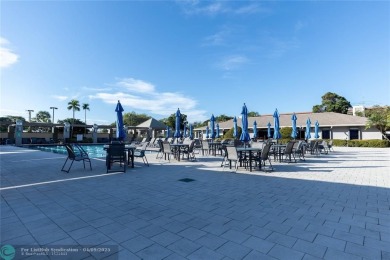 A breathtaking view and a peaceful living environment where life on Wynmoor Golf Course in Florida - for sale on GolfHomes.com, golf home, golf lot