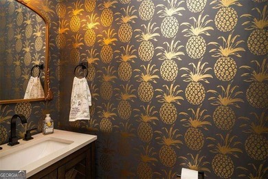 Discover timeless elegance and modern comfort in this on Woodmont Golf and Country Club in Georgia - for sale on GolfHomes.com, golf home, golf lot