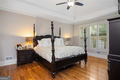 Discover timeless elegance and modern comfort in this on Woodmont Golf and Country Club in Georgia - for sale on GolfHomes.com, golf home, golf lot