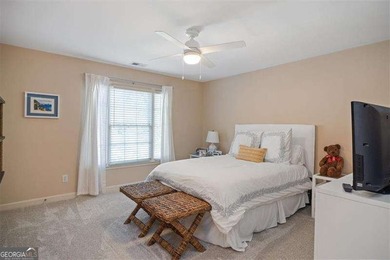 Discover timeless elegance and modern comfort in this on Woodmont Golf and Country Club in Georgia - for sale on GolfHomes.com, golf home, golf lot